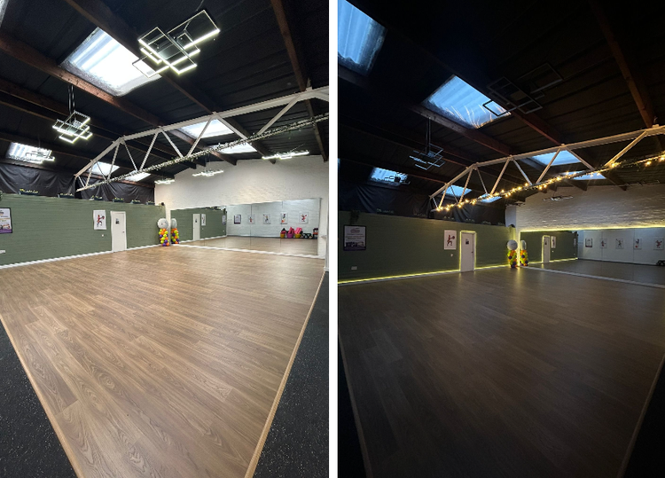 Spacious indoor activity hall with wooden flooring, skylights and LED lighting