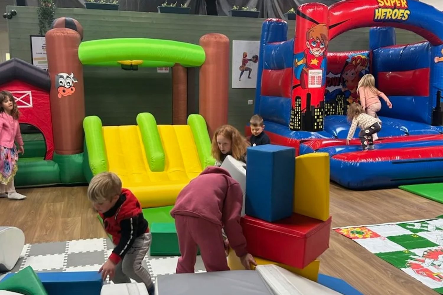 Children playing on an inflatable bouncy castle at MissionFIIT