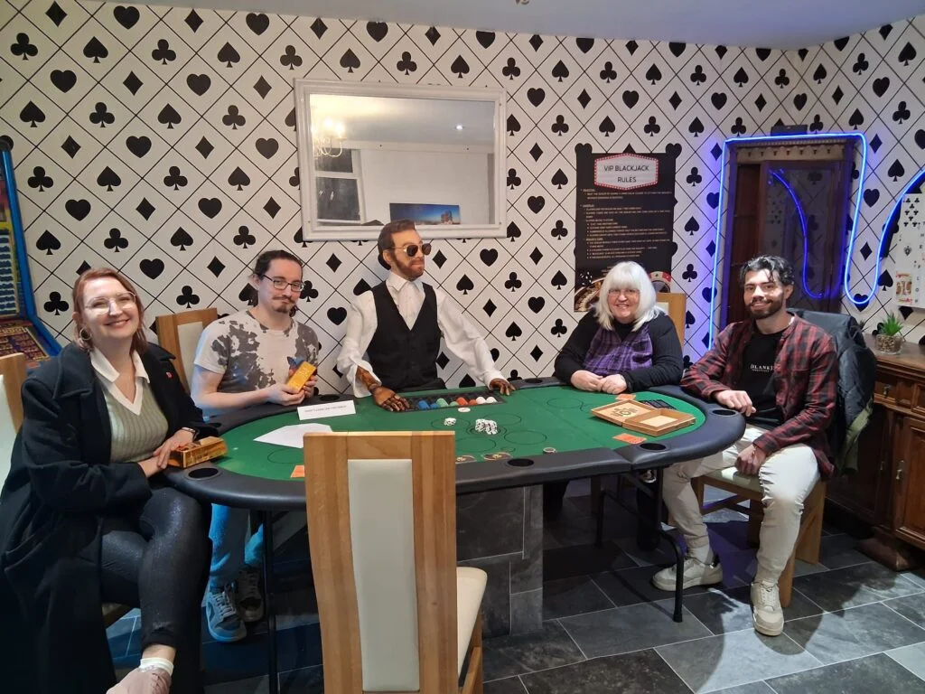 Group playing casino themed escape room game